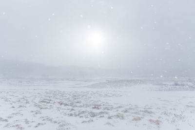 Scenic view of sea against sky during winter