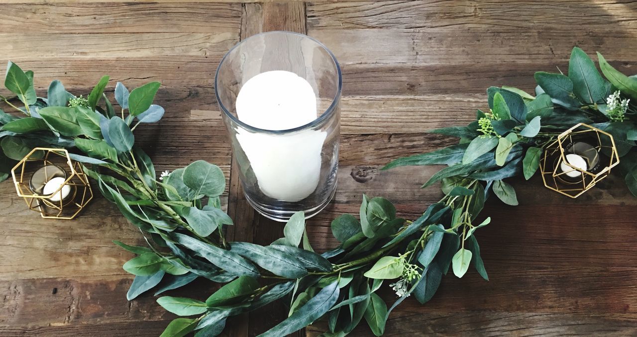 wood - material, table, leaf, milk, food and drink, indoors, drinking glass, food, freshness, high angle view, directly above, green color, ingredient, no people, drink, healthy eating, herb, plant, basil, day, close-up