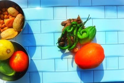 High angle view of tomatoes and fruits on floor