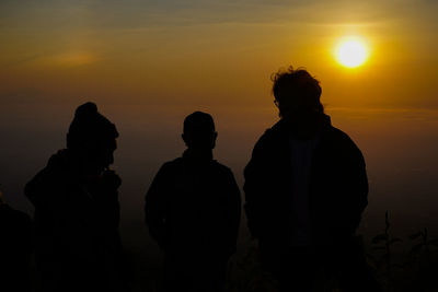 Silhouette people at sunset