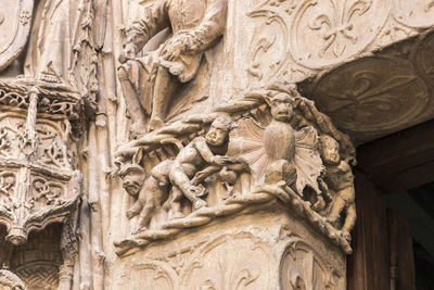 Low angle view of statues on old building