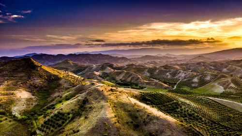 Scenic view of landscape against sky during sunset