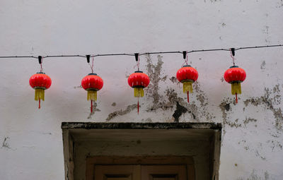Lanterns hanging against wall