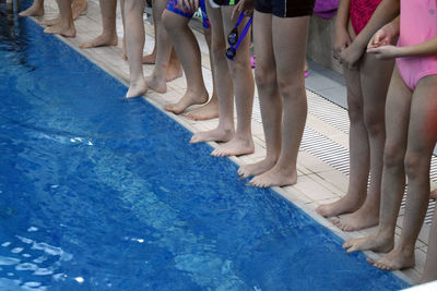 Low section of people on swimming pool