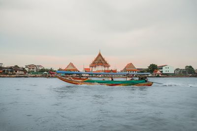 Boat in sea against sky