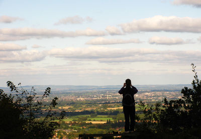 Man overlooking countryside landscape