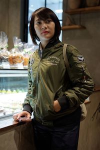 Mid adult woman standing in bakery shop