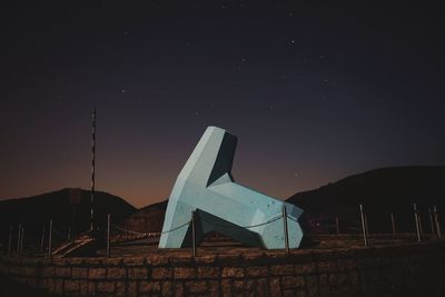 Built structure against sky at night