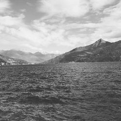 Scenic view of mountains against cloudy sky