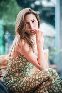 Portrait of woman sitting outdoors
