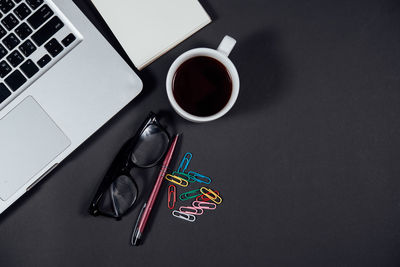 High angle view of coffee cup on table