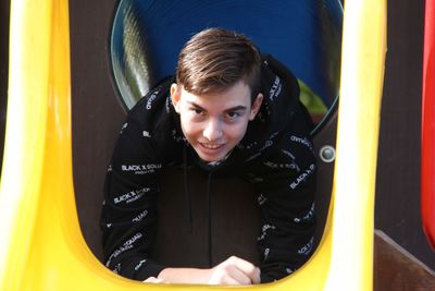 Portrait of smiling boy in playground