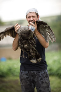 Local agriculture, farmer's day 12 october. turkey in the hands of a man, natural products 