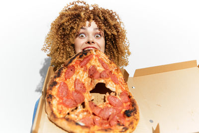 Portrait of young woman having food