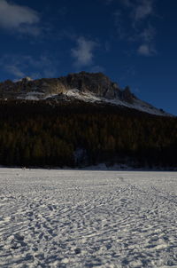 Scenic view of lake against sky during winter