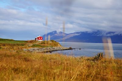 Scenic view of mountains against cloudy sky
