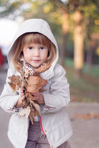 Portrait of cute girl standing outdoors