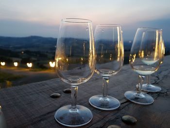 Close-up of wine glasses on table