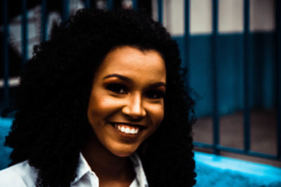 Close-up portrait of smiling young woman