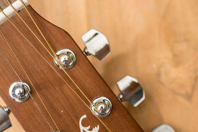 High angle view of guitar on table