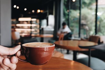 Coffee cup on table in cafe