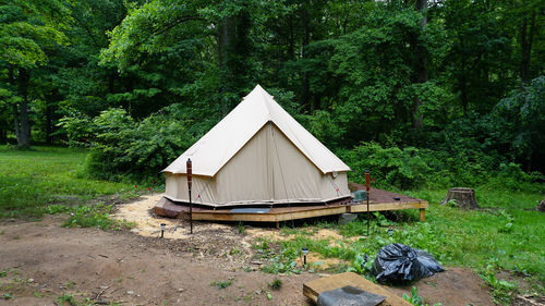 Off grid wall tent in the woods. cottagecore living in the wilderness. bushcraft / survival yurt