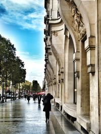 People in city against sky