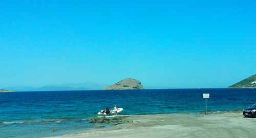 Scenic view of sea against clear blue sky