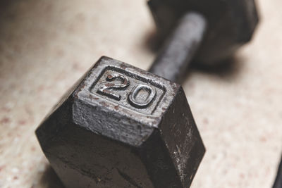 Close-up of dumbbell on floor