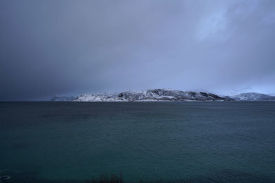 Snowy mountains and seascape in tromso