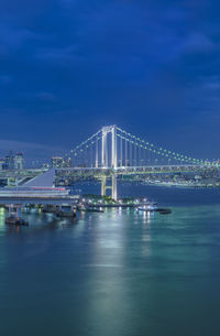 Circular highway leading to the rainbow bridge in odaiba bay of tokyo.