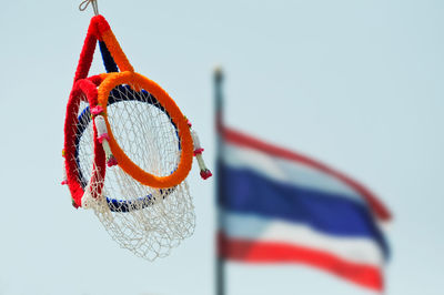 Close-up of multi colored hanging against clear sky