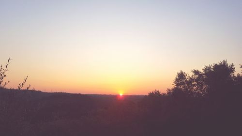 Scenic view of landscape at sunset