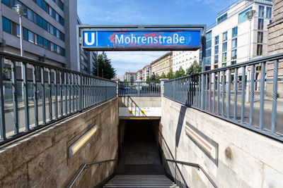 Information sign on railing in city