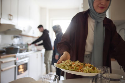 Family cooking together for eid al-fitr at home