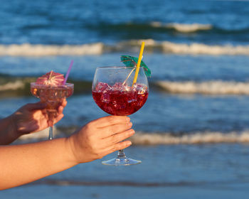 Close-up of hand holding wineglass