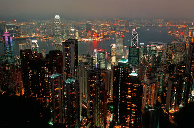 High angle view of illuminated city buildings at night