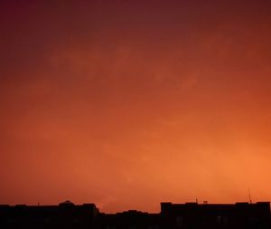 Silhouette of building at sunset