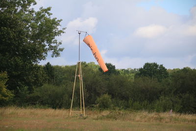 Built structure on field against sky