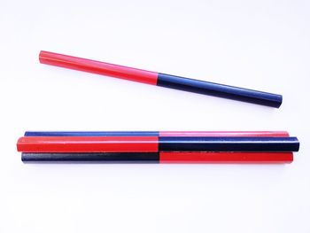 Close-up of colored pencils against white background