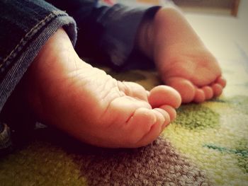Low section of baby feet