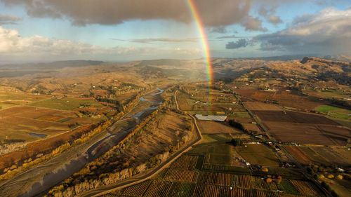 Aerial view of rainbow over landscape