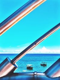 Close-up of sea against blue sky