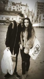 Young couple standing in city