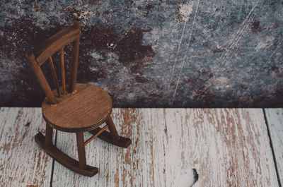 High angle view of old chair on table at home