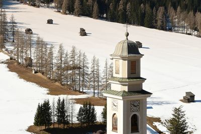 Panoramic view of building and trees during winter