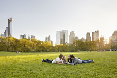 Friends relaxing together in park