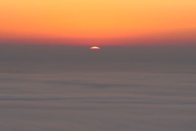 Scenic view of orange sky