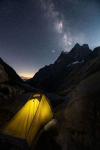 Scenic view of mountains against sky at night