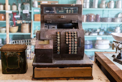 Close-up of old objects on table at store